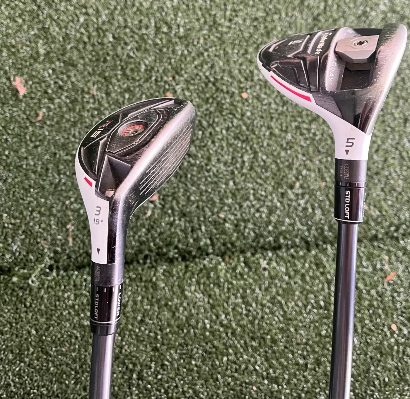 Todd's TaylorMade R15 3-hybrid and 5-wood placed side by side on turf.